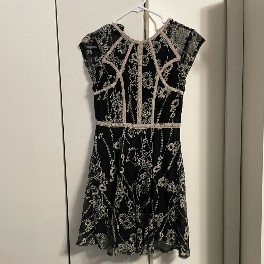 FREE PEOPLE. Size 2 black Lacey mini dress.
